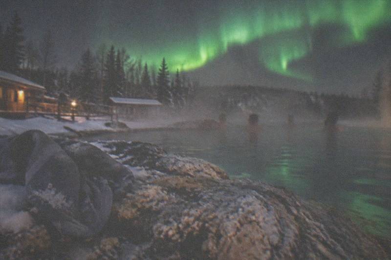 Night bathers in the steaming rock pool at Chena Hot Springs Resort, Fairbanks, Alaska